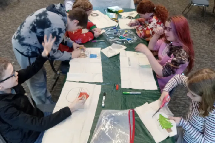 NK Homeschool Community children making art together around a classroom table